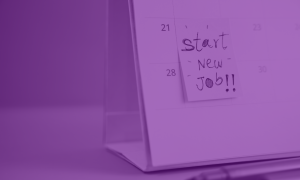 Image of a physical desk calendar with a sticky note attached to it. On the note someone has written "Start New Job!!"